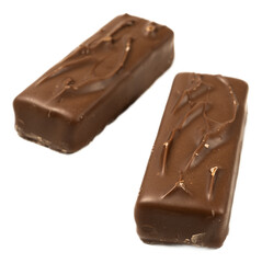Delicious chocolate bars with caramel nougat and peanut filling isolated on transparent background