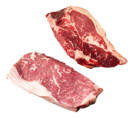 Fresh marbled boneless ribeye steak cuts with rich red color and textured fat on black background, juicy and premium beef slices for grilling or cooking