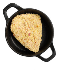 Crispy breaded meat schnitzel cutlet in a black skillet isolated on transparent background, raw and...