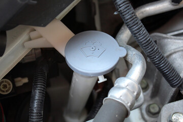 Car Washer Fluid Filler Cap. Car Washer Fluid Reservoir. Closeup blue windshield washer fluid...