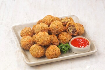 Bitterballen is the name of a type of food in the Netherlands. Bitterballen taste similar to croquettes, but are small round shapes about 3 to 4 cm