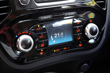 Automatic climate control with a temperature of 21 degrees. Car air conditioning on minimum cold...