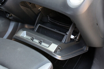 Open glove compartment of a modern car. Modern car passenger airbag. Glove compartment in white car...