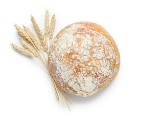 Loaf of fresh bread and wheat ears isolated on white background