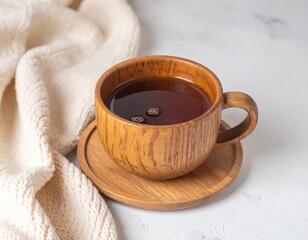 Wooden Cup of Tea on Wooden Coaster with Knitted Fabric