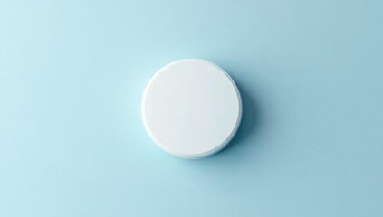 White oval object on light blue surface