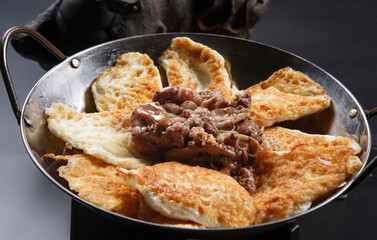 Braised fish with poached eggs