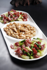 Fried sausage, cashews and asparagus