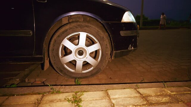 Car powers up and pauses close to road border