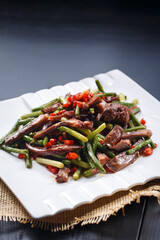 Stir-fried pork head with garlic sprouts