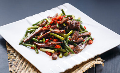 Stir-fried pork head with garlic sprouts