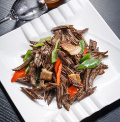 Stir-fried pork belly with bell pepper and pine mushrooms