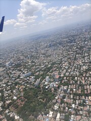 Aerial View of a Vast Urban Landscape Under a Blue Sky