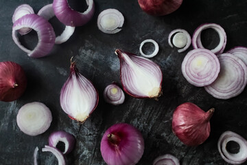 set of onion slices on black background