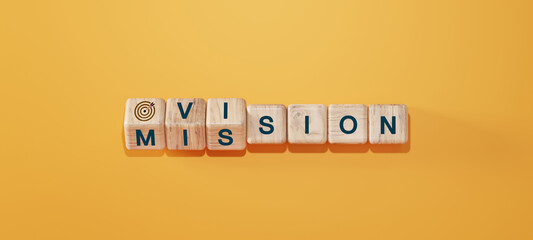 Wooden cubes with words "Vision" and "Mission" arranged on orange background with target icon. Concept of business strategy, goal setting, leadership, and corporate planning.