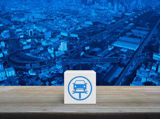 Service fix car with wrench tool flat icon on white block cube on wooden table over modern city tower, street, expressway and skyscraper, Business repair car service concept