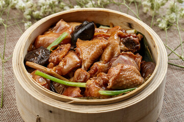 Steamed mushroom and baby chicken in bamboo basket
