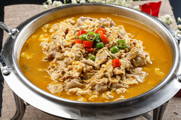 Sour lamb soup in stainless steel cutlery