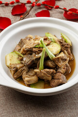 Lamb chops stewed with green radish in white casserole