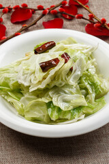 Shredded cabbage in white porcelain plate