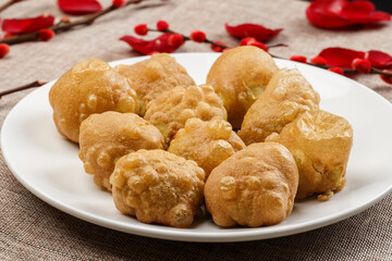 Fried cakes on white porcelain plate