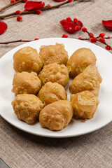 Fried cakes on white porcelain plate