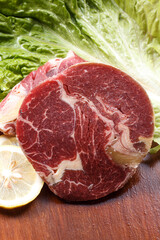 Australian ribeye steak on a wooden cutting board