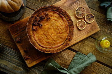 Pumpkin pie garnished with anise. Homemade traditional American thanksgiving pie, top view