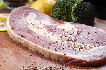 Angus beef brisket on wooden cutting board