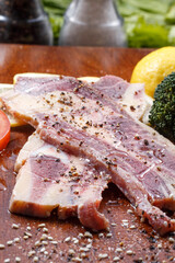 Australian beef ribs on a wooden chopping board