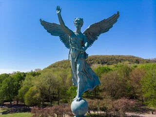 Statue of an angel overlooking Montreal, Canada. The statue is a monument to peace, and it stands in Mount Royal Park.  Monument To Sir George-éTienne Cartier.