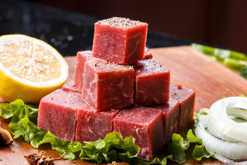 Beef leg steak on a wooden cutting board