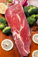 Beef shoulder triangle meat on a wooden cutting board