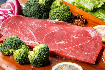 Beef rump on a wooden cutting board