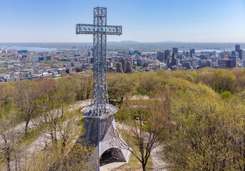 The Mount Royal Cross stands tall overlooking Montreal, Canada. The cross is a landmark and symbol...