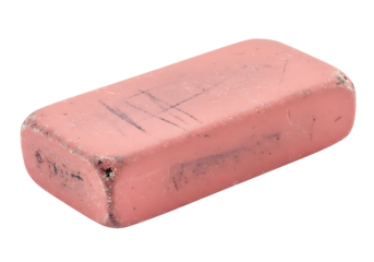A used pink eraser shows wear and tear, featuring marks and debris from erasing pencil on transparent background.