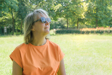 Summer aerial portrait of a woman 30-40 years old