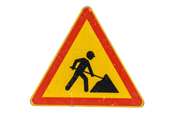 A weathered road sign warns of road work ahead, the triangular symbol featuring a construction worker digging, conveying a sense of caution.