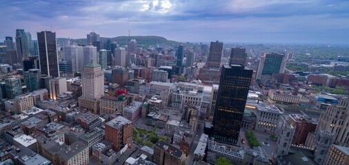 Aerial view of Montreal, Canada, showcasing the city's skyline with its mix of modern skyscrapers...