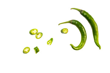 fresh green chili with slices of chili isolated on a white background