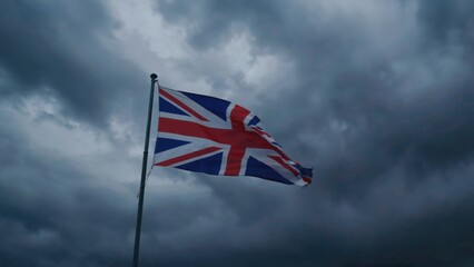 UK flag against gloomy sky