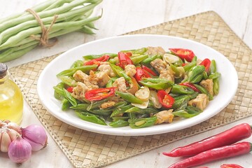 Tumis Buncis. Oseng green beans tempeh is stir-fried green beans cooked with tempeh seasoned with sliced ​​chilies, garlic and shallots