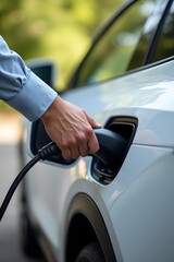Connecting Electric Car to Charging Station — Close-Up of Man’s Hand