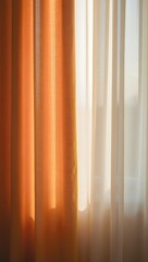 Sheer Orange and White Curtains Illuminated by Soft Morning Sunlight Creating a Warm Inviting Atmosphere