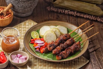 Sate Ayam. Chicken satay is a typical Indonesian food. Chicken satay is made from chicken meat. In general, chicken satay is cooked by grilling using charcoal and served with a choice of peanut sauce 