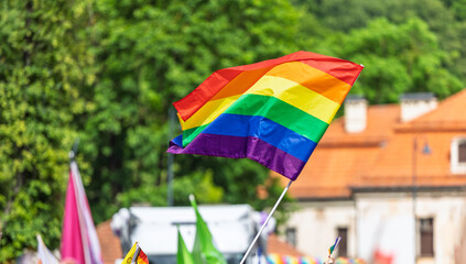 Vibrant Rainbow Flag Waving During a Colorful Outdoor Celebration Event