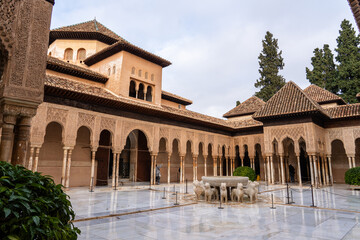 The interior courtyard of the Alhambra in Granada, Spain, highlighting its intricate Moorish...