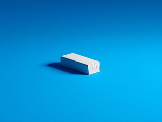 Simple white rectangular object on blue background