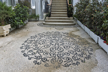 a finely arranged pebble floor, forming a decorative mosaic typical of the island of Rhodes, Greece.