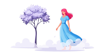 Serene Woman in Blue Dress Walking by a Tree